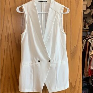 White vest with buttons and pockets